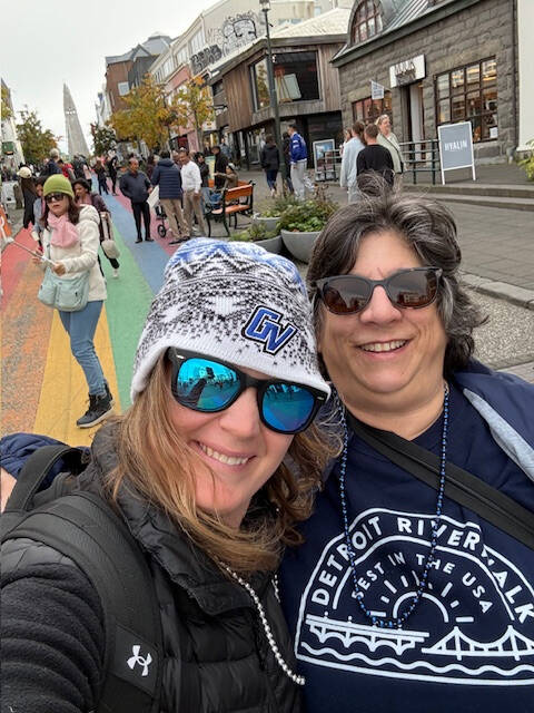 Two Lakers walk the streets of a city in Iceland